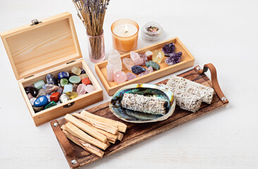 Smudge kit with white sage, palo santo, candles, reiki chrystals. Natural elements for wellbeing, holistic lifestyle idea