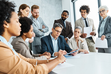 young business people meeting office teamwork group contract signing agreement document signature paperwork success corporate senior mature