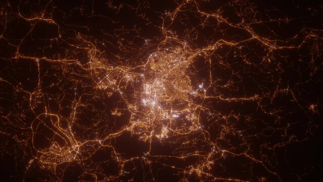 Daejeon (South Korea) top view at night. Top view on modern city with street lights and glow effect. Camera is zooming in, rotating clockwise. Vertical video. The north is on the left side