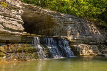 An old water diversion tunnel along a river.