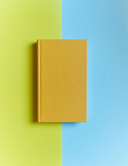 yellow book on yellow-blue background