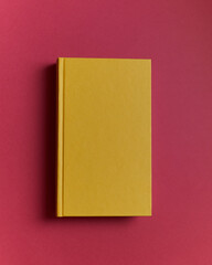 yellow book on red background