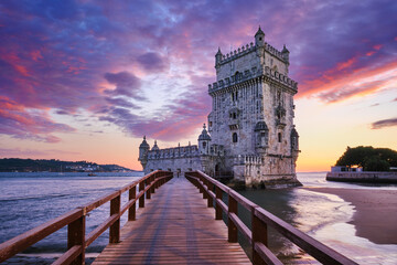 Belem Tower or Tower of St Vincent - famous tourist landmark of Lisboa and tourism attraction - on the bank of the Tagus River (Tejo) in evening dusk after sunset with dramatic sky. Lisbon, Portugal - 634358689