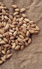 Pistachios on burlap sack. Healthy food high protein. Dietary nutrition. close-up