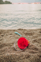 baby scoop and bucket on the beach © Kate