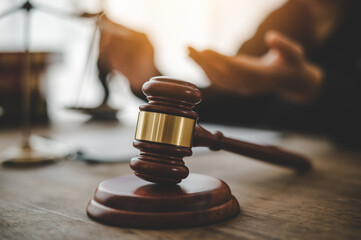 Law theme, mallet of the judge, law enforcement officers, evidence-based cases and documents taken...