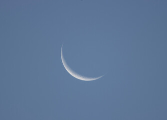 The waning crescent moon, gracefully nearing the end of its lunar journey, presents a tranquil yet...