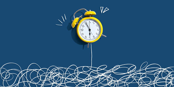 Alarm clock with chaos and confusion theme - flat lay