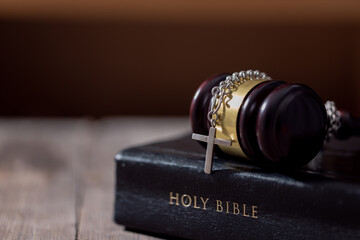 Holy bible book and judge's gavel on table background. Judicial system, constitution, democracy,...