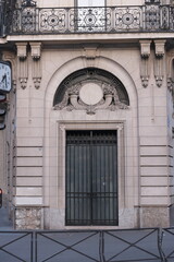Fancy ornament details and decorations shot on Paris building facades. Doors and windows surround, decorated balconies.