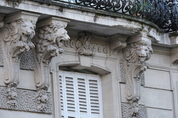Fancy ornament details and decorations shot on Paris building facades. Doors and windows surround, decorated balconies.
