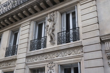 Fancy ornament details and decorations shot on Paris building facades. Doors and windows surround, decorated balconies.