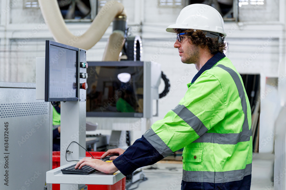 Poster portrait of a male engineer operating a computer, designing and controlling a machine. in the furnit
