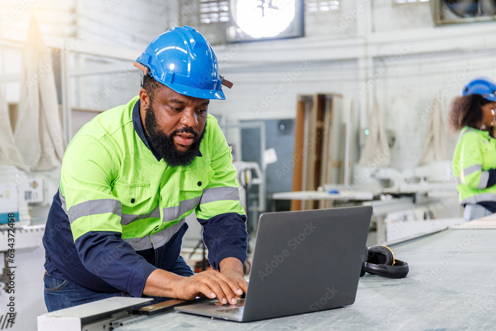 Poster portrait of a male engineer operating a computer, designing and controlling a machine. in the furnit