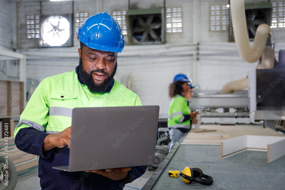 Poster portrait of a male engineer operating a computer, designing and controlling a machine. in the furnit