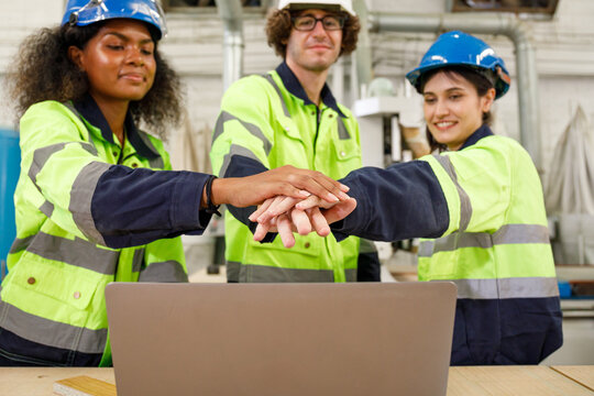 Portrait of a team of male and female engineers in uniform Smiling to express happiness in accomplishing the goal