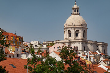 Beautiful view of rooftops in Lisbon, Portugal on a sunny day with space for text. National Pantheon set amongst the vibrant orange rooftops. - 634376294