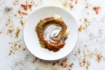 A messy mixture of spices used to make a taco seasoning blend.
