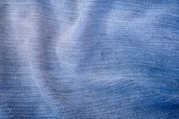 abstract background of old blue denim close up