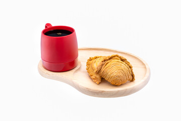  curry puff and red coffee mug on wooden plate close up,isolated