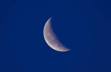 Obraz na płótnie Canvas crescent moon on blue night sky,thailand