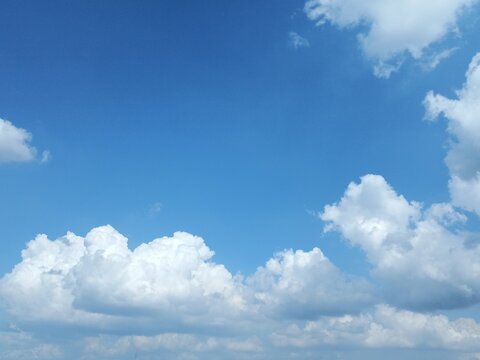 Clouds forming in a clear blue sky. bright natural scenery.