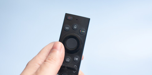 Smart television remote controller isolated on blue background. 