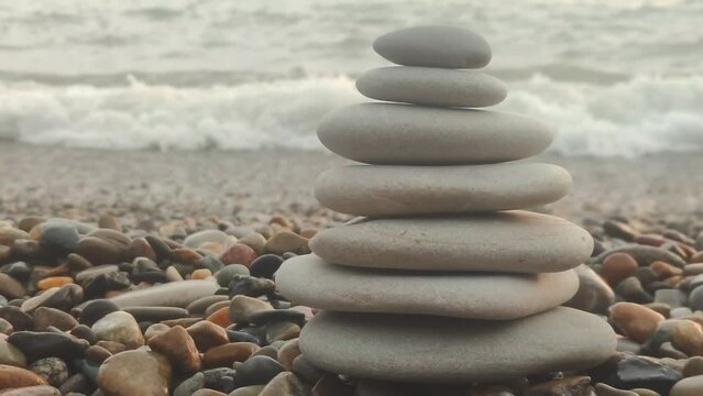 Pyramid on seashore on seashore at sunset.