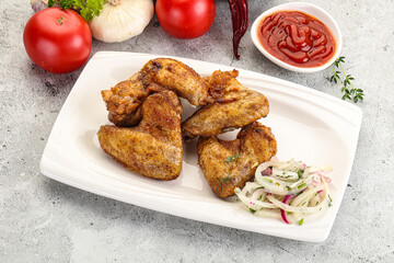 Grilled chicken wings with sauce