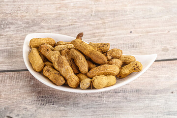 Raw ripe unpeeled peanut heap