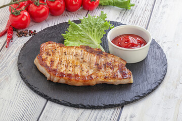 Grilled pork steak with ketchup