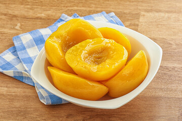 Sweet canned peaches with syrope