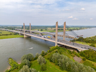 Aerial drone photo of an highway bridge over the river Waal in the Netherlands