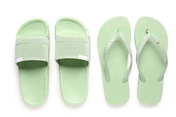 Colorful pairs of female flip flops on white background