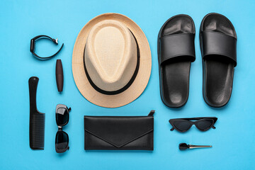 Composition with stylish beach accessories, cosmetics and smart watch on color background