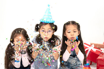 Group of Cheerful Asian Kids Enjoying Party with Friends in Celebrate Event, Happy Children Having Fun with Friends at School in Christmas New Year Party.