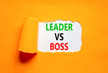 Boss vs leader symbol. Concept words Boss vs versus leader on beautiful white paper. Beautiful orange background. Business motivational boss vs leader concept. Copy space.