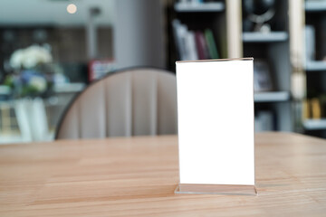Menu mack up blank for text marketing promotion. Mock up Menu frame standing on wood table in restaurant space for text.