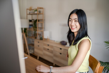 Obraz premium Graphic designer working on digital tablet and computer. Designer Asian Woman artist drawing on graphic tablet Artist Creative Designer sketch graphic drawing creative