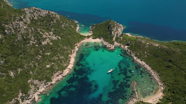 Stunning aerial perspective of Porto Timoni Beach and its mesmerizing blue turquoise waters on a sunny day in Corfu Island