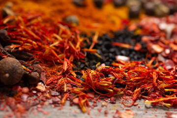 Paprika, pepper and turmeric spice at table background. Variety of spices and ingredients