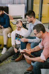 Male coworkers sitting at the office