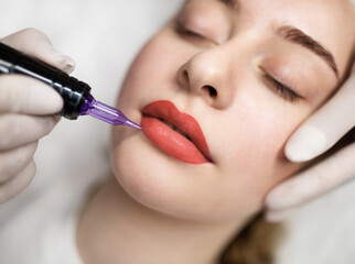 Lip Blushing. Cosmetologist applying permanent make up on lips of beautiful woman - obrazy, fototapety, plakaty