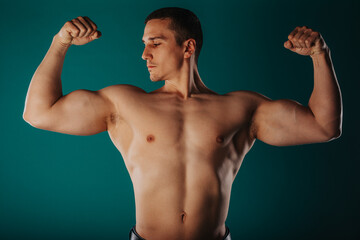 Aesthetic man flexing his biceps