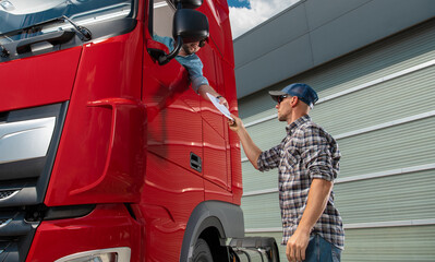 Semi Truck Driver Receiving Cargo Documentation