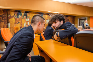 Two students talking in class