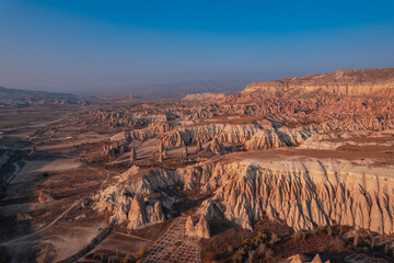 Sunset landscape Cappadocia stone and old cave house in Goreme national park Turkey sunlight,...