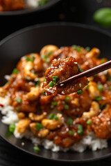 Crispy cashew Chicken stir fry with rice. Asian take away food