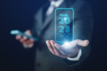 2023 business concept, businessman or engineer Show the trend of driving digital currency to develop online business.
