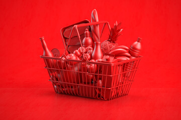 Red shopping basket full of grocery foods on red background.